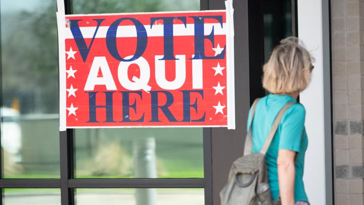 Family voting together in New Braunfels, Texas, during early voting period.